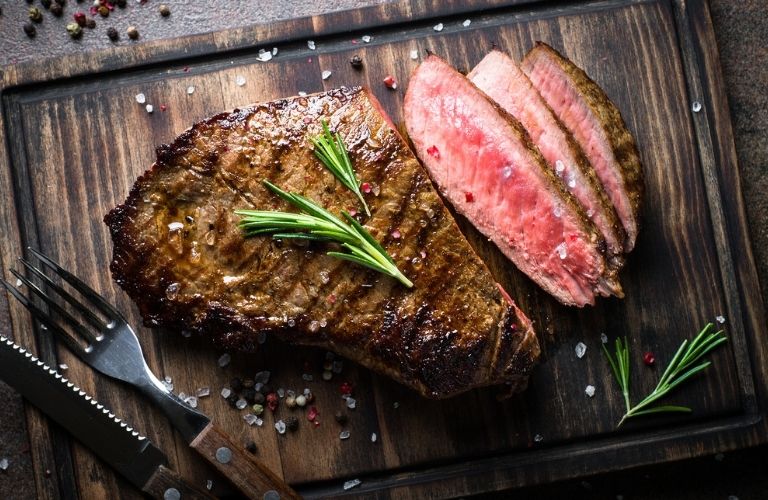 A steak and its cut pieces