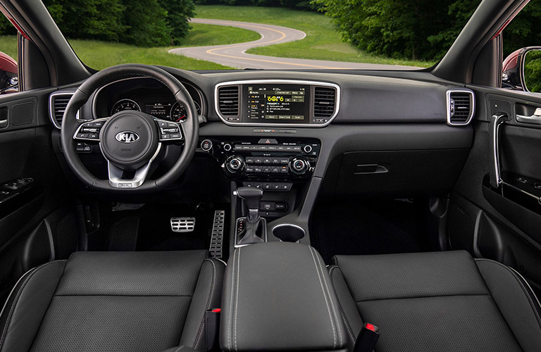 Steering wheel and interior of the 2022 Kia Sportage.