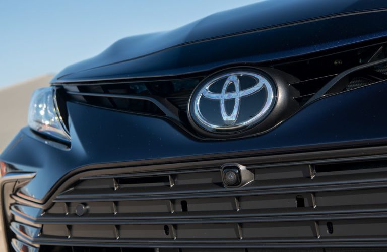 Close up of the 2021 Toyota Camry's front grille and Toyota emblem 