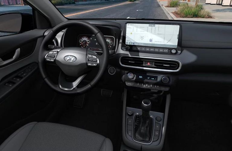 Interior steering wheel area of the 2022 Hyundai Kona is shown.