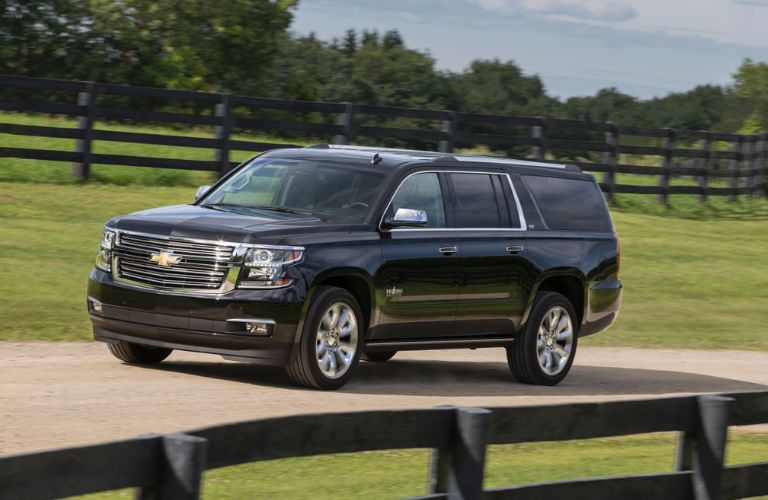 2015 Chevrolet Tahoe in black driving