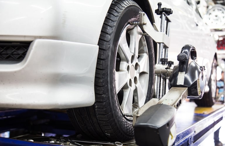 Closeup of a vehicle's tire at a service center