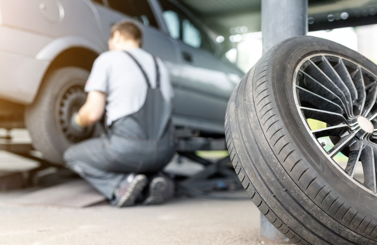 Mechanic repairing a tire 