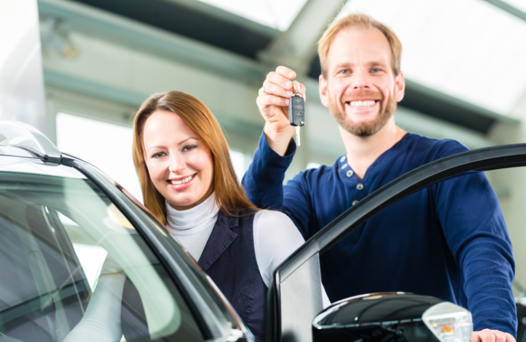 Couple showing keys 