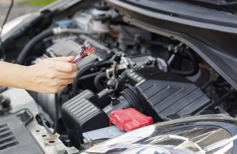 Technician repairing engine